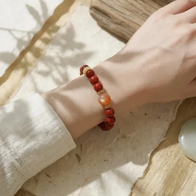Vibrant single-loop Bing Yang Fire metaphysical bracelet worn gracefully on the wrist.
