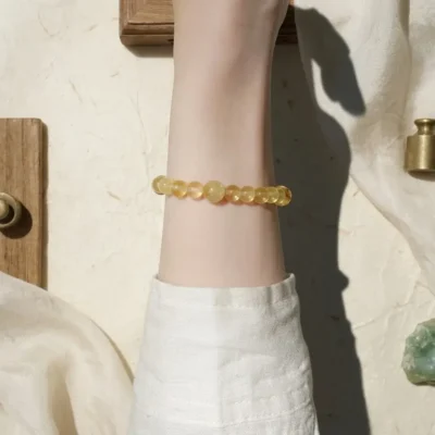 Minimalist single-loop Wu Yang Earth grounding bracelet worn on the wrist.