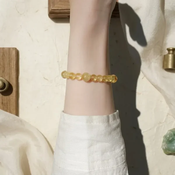 Minimalist single-loop Wu Yang Earth grounding bracelet worn on the wrist.