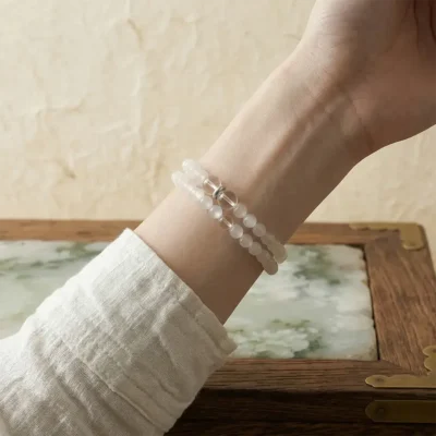 Double-loop Xin Yin Metal crystal bracelet worn on the wrist, highlighting self-improvement and grace.